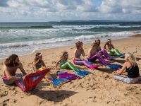 BOURNEMOUTH, ENGLAND - AUGUST 19: Mermaiding instructor Michelle Forsbrey (R) speaks with students of her Mayim Mermaid Academy during a lesson on Boscombe Beach on August 19, 2017 in Bournemouth, England. The ancient Assyrian goddess Atargatis is thought to be one of the earliest mermaids and like Ea, the Babylonian god of the sea from around 4000bc, she had the upper body of a human and the lower body of a fish. Throughout history Merfolk have been popular in art and literature. A well known Hans Christian Anderson fairy tale "The Little Mermaid" (1836) was adapted to an animated film in 1990 and is still popular today. Recently the practice of mermaiding has become popular across the world as an extreme sport and cosplay/performance art. Mermaiding involves the wearing of a costume mermaid tail, consisting of a plastic monofin covered in a fabric, while swimming or performing. The practice of mermaiding has been taught by professional instructors in the UK since 2006. (Photo by Jack Taylor/Getty Images)