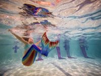BOURNEMOUTH, ENGLAND - AUGUST 19: Mermaiding students swim in their tails during a Mayim Mermaid Academy lesson at the swimming pool at Bournemouth Collegiate School on August 19, 2017 in Bournemouth, England. The ancient Assyrian goddess Atargatis is thought to be one of the earliest mermaids and like Ea, the Babylonian god of the sea from around 4000bc, she had the upper body of a human and the lower body of a fish. Throughout history Merfolk have been popular in art and literature. A well known Hans Christian Anderson fairy tale "The Little Mermaid" (1836) was adapted to an animated film in 1990 and is still popular today. Recently the practice of mermaiding has become popular across the world as an extreme sport and cosplay/performance art. Mermaiding involves the wearing of a costume mermaid tail, consisting of a plastic monofin covered in a fabric, while swimming or performing. The practice of mermaiding has been taught by professional instructors in the UK since 2006. (Photo by Jack Taylor/Getty Images)